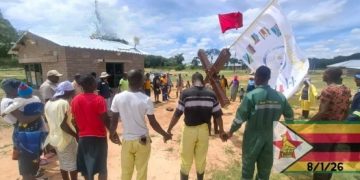Enthusiastic crowds slow down cross walk through Zimbabwe